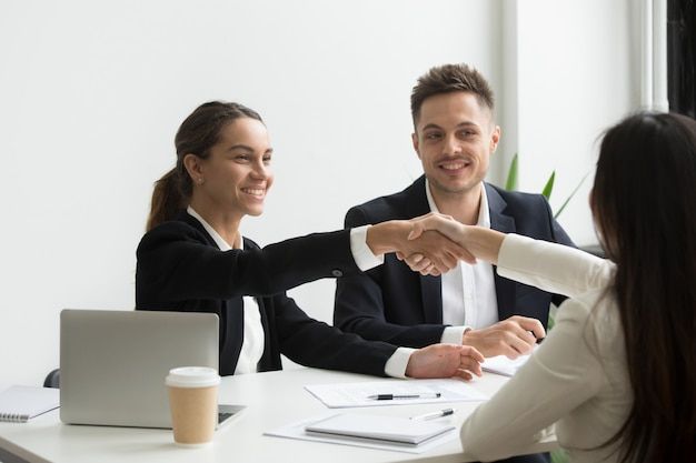 Home Hr Representatives Positively Greeting Female Job Candidate Free Photo